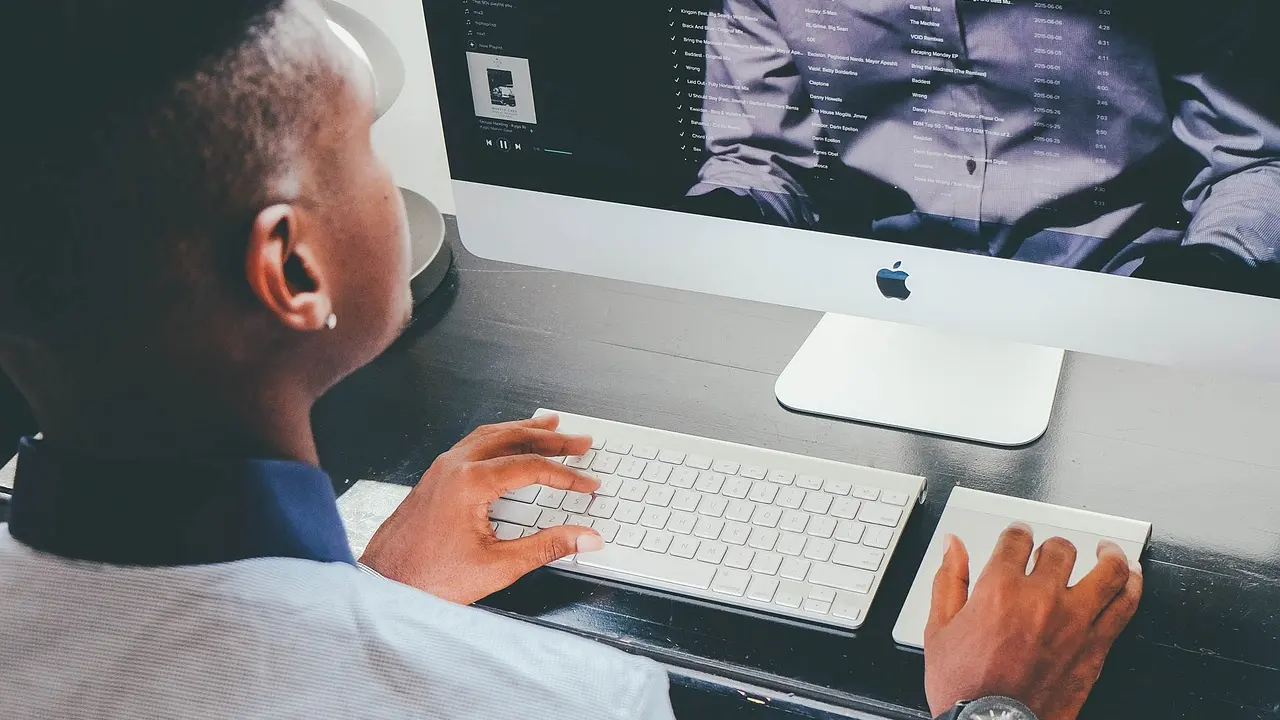 A person typing a website address into a search bar