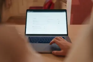 A person typing a website address into a search bar